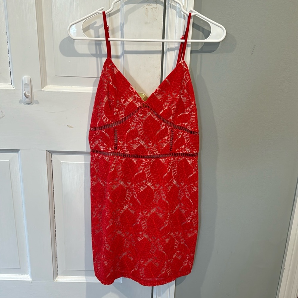 Red mini dress with lattice cutouts